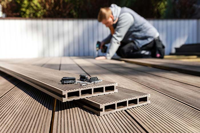 Man repairing composite deck