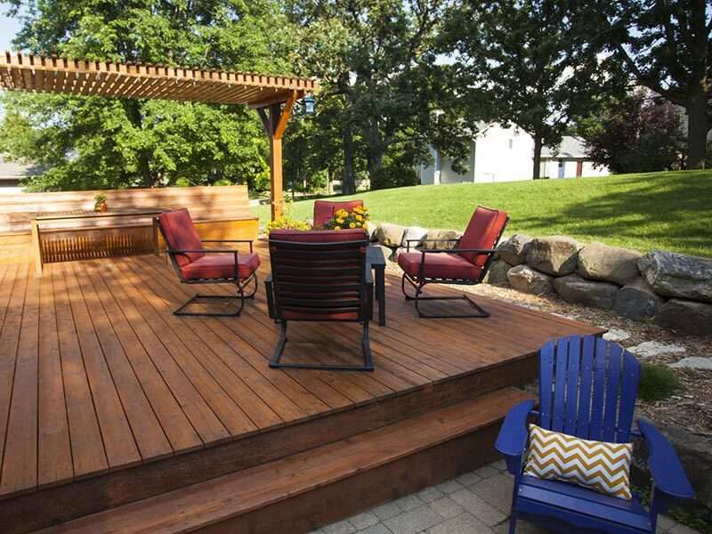 Wood deck with seating by Advance Roofing Windows Siding Doors Decks in Newark, DE